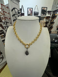 Bold gold necklace with diamond teardrop